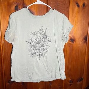 This green shirt with flowers on it is a large.